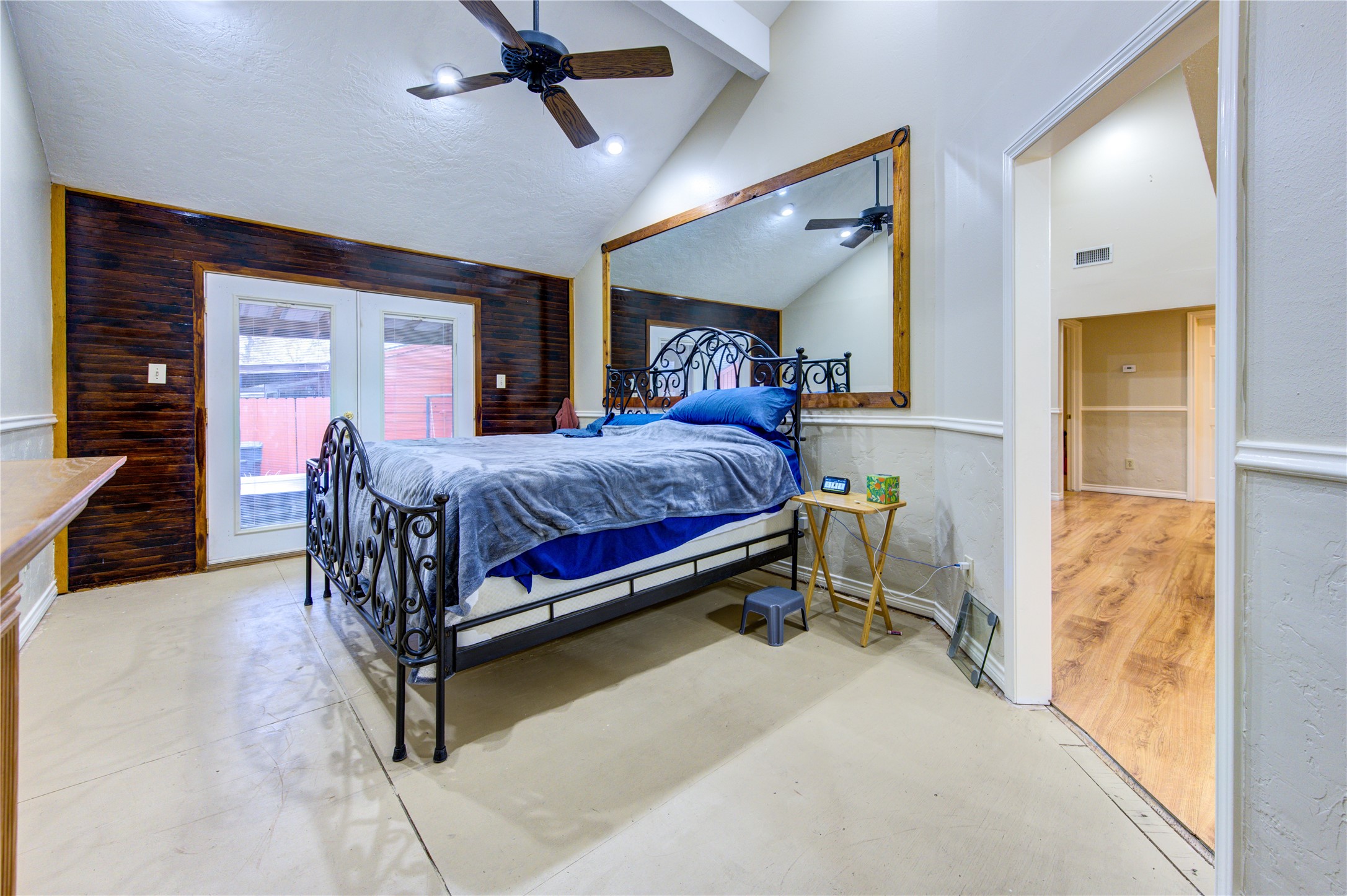11217 Todd Street Houston, TX 77055 - Photo 23 of 49 a bedroom with a bed and a chandelier