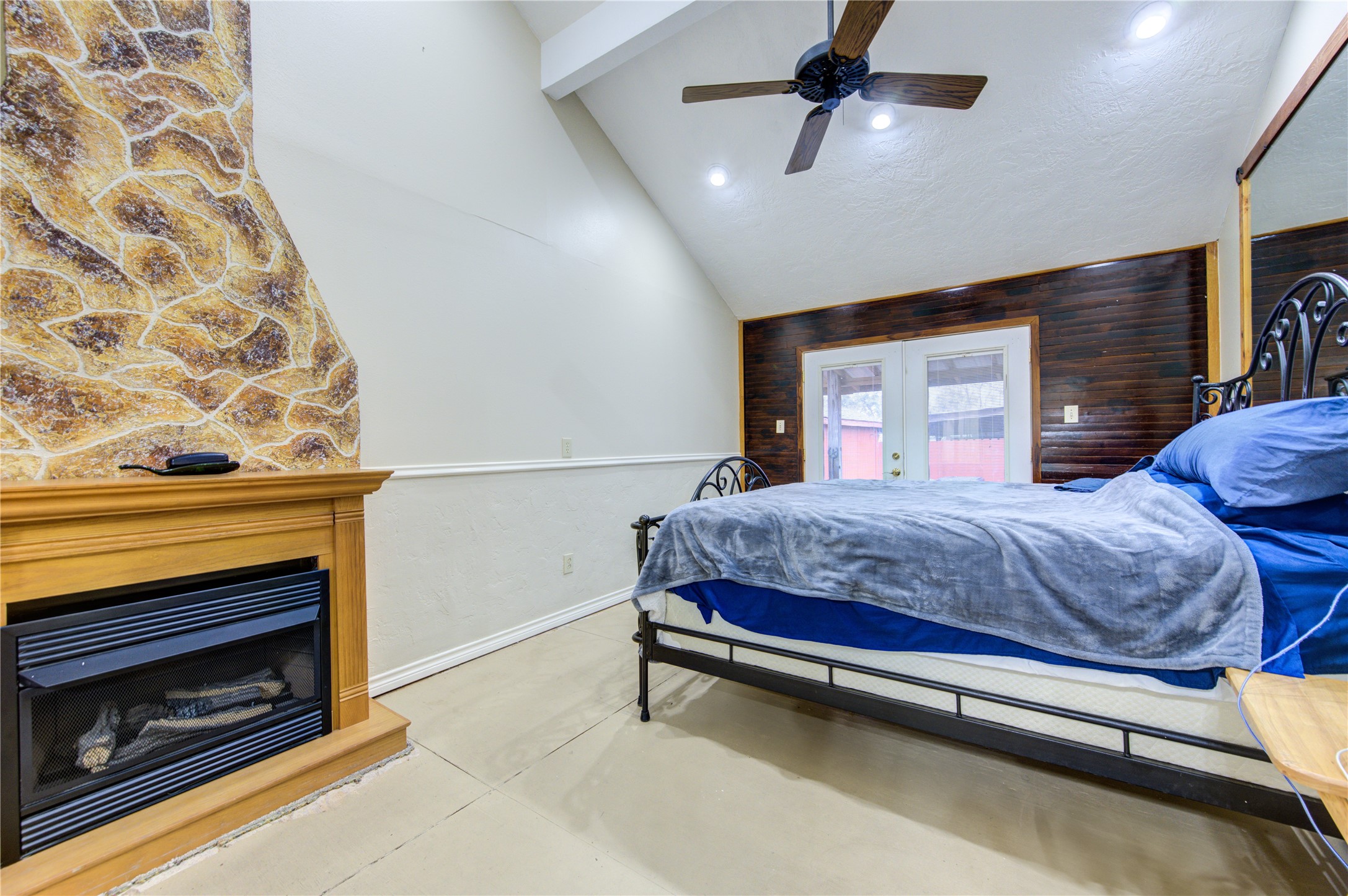 11217 Todd Street Houston, TX 77055 - Photo 25 of 49 a bedroom with a bed and a fireplace