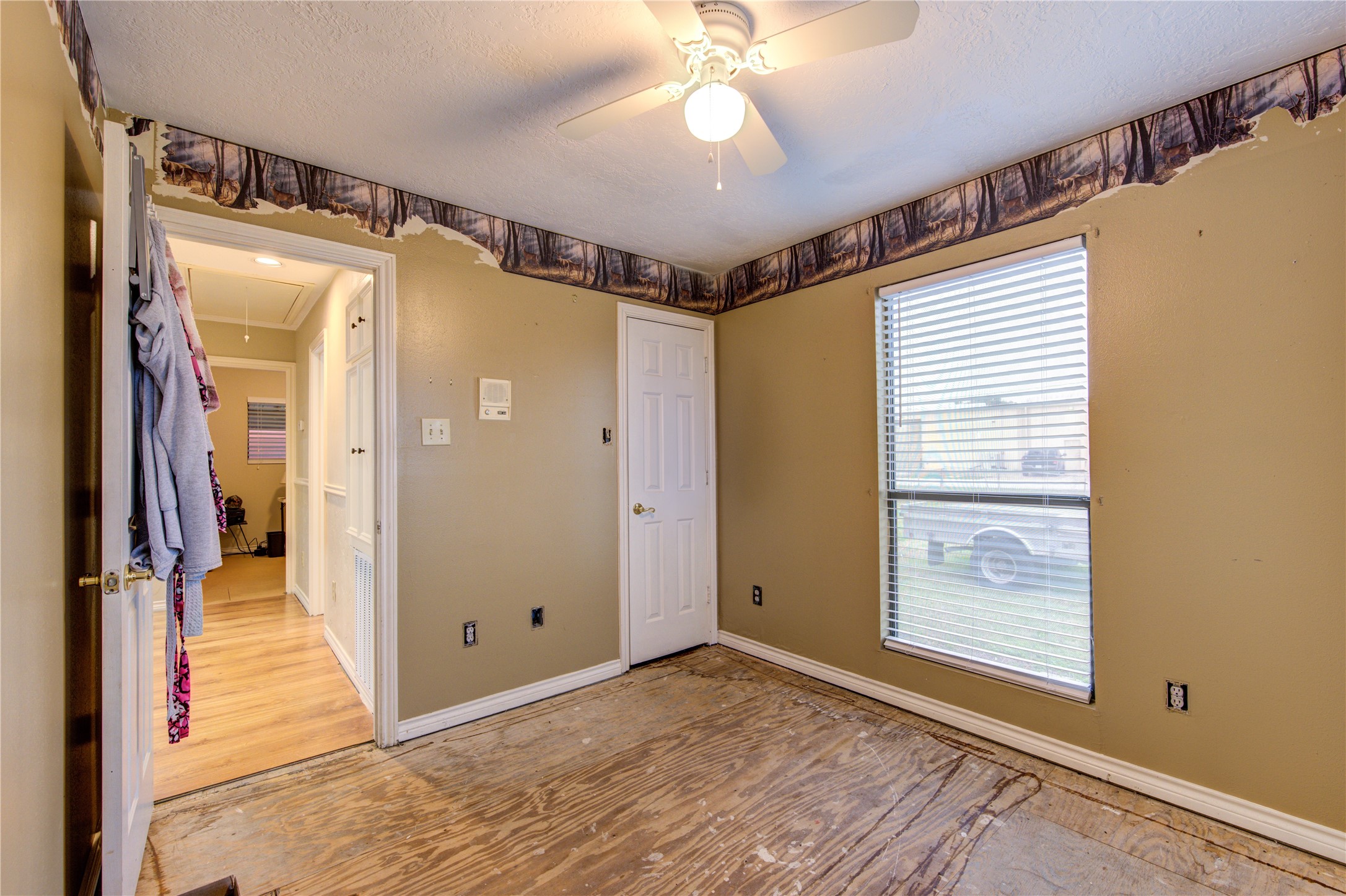 11217 Todd Street Houston, TX 77055 - Photo 30 of 49 a view of an empty room with wooden floor and a window