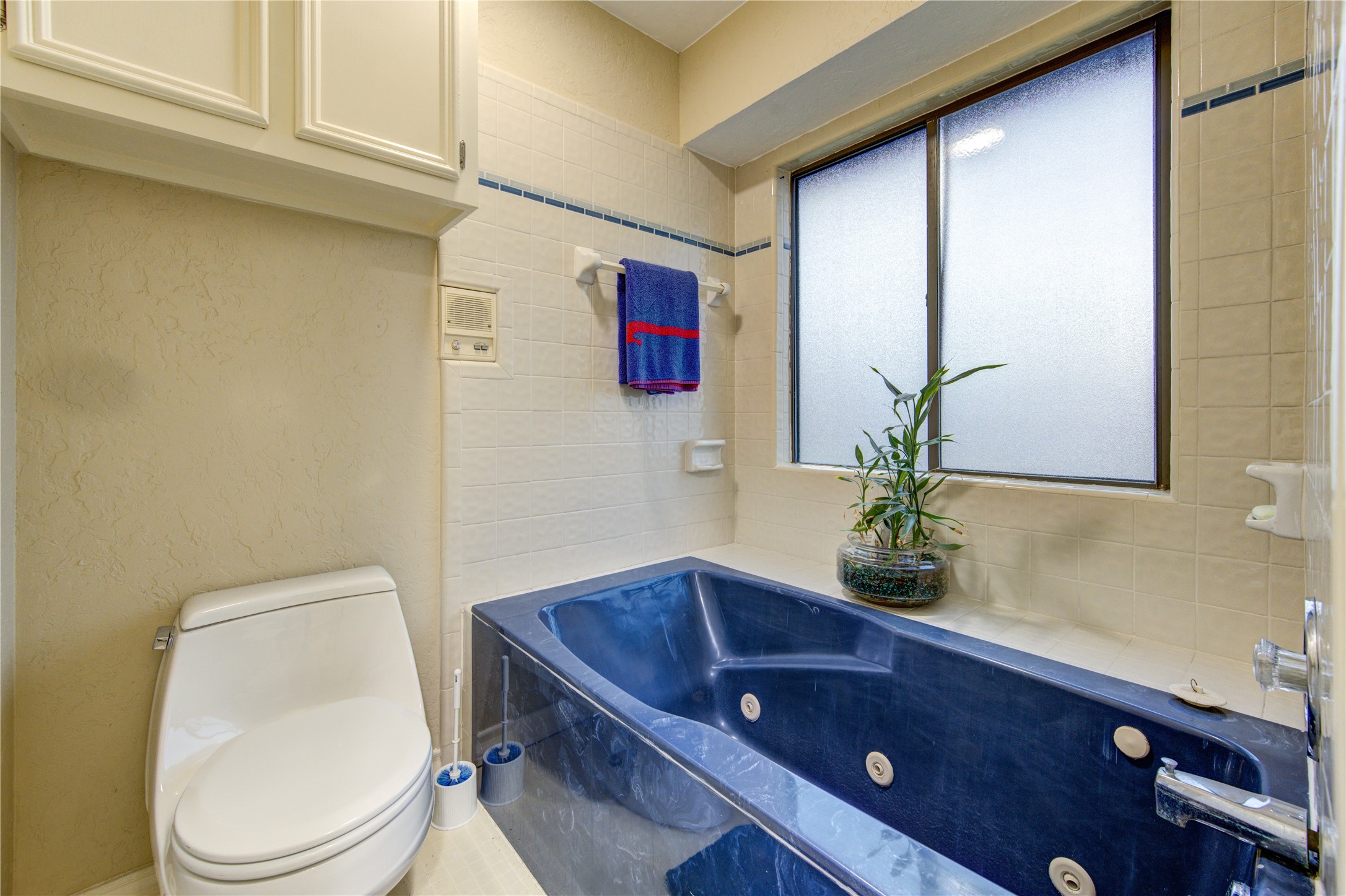 11217 Todd Street Houston, TX 77055 - Photo 35 of 49 a bathroom with a toilet sink and mirror