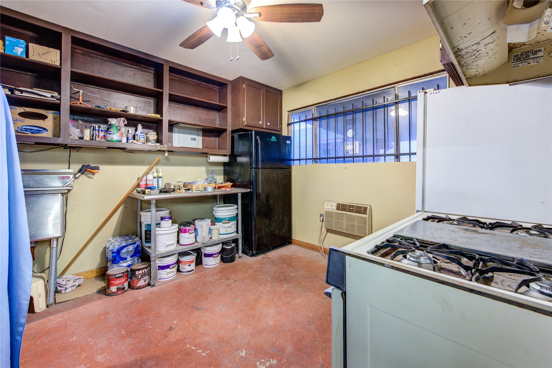 11217 Todd Street Houston, TX 77055 - Photo 38 of 49 a view of a kitchen with fridge and a window