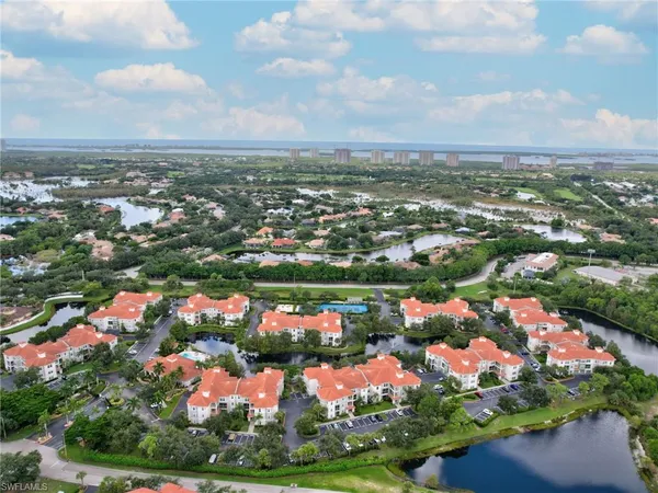 an aerial view of residential houses with outdoor space and street view