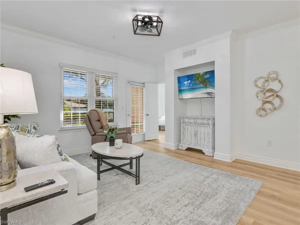 a living room with furniture and a rug
