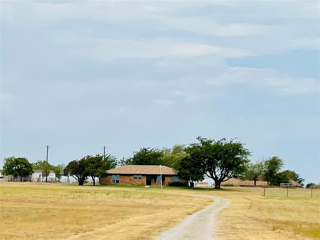 4203 Weiland Road Weatherford, TX 76088 - Photo 2 of 29 a view of a swimming pool with an outdoor seating and a yard