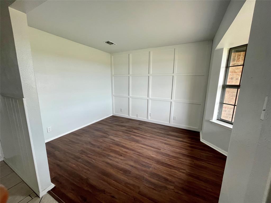 4203 Weiland Road Weatherford, TX 76088 - Photo 3 of 29 a view of a room with wooden floor and window