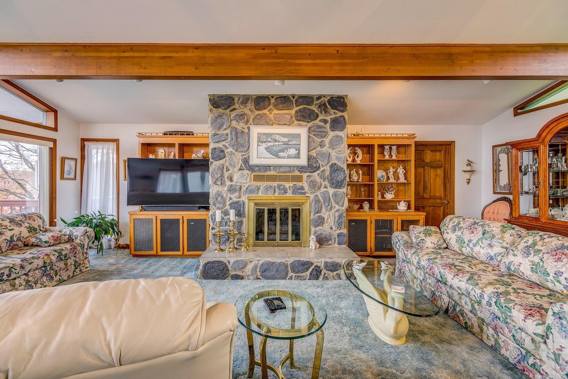 3624 Kemp Ford Road Union Hall, VA 24176 - Photo 15 of 60 a living room with furniture a fireplace and a potted plant