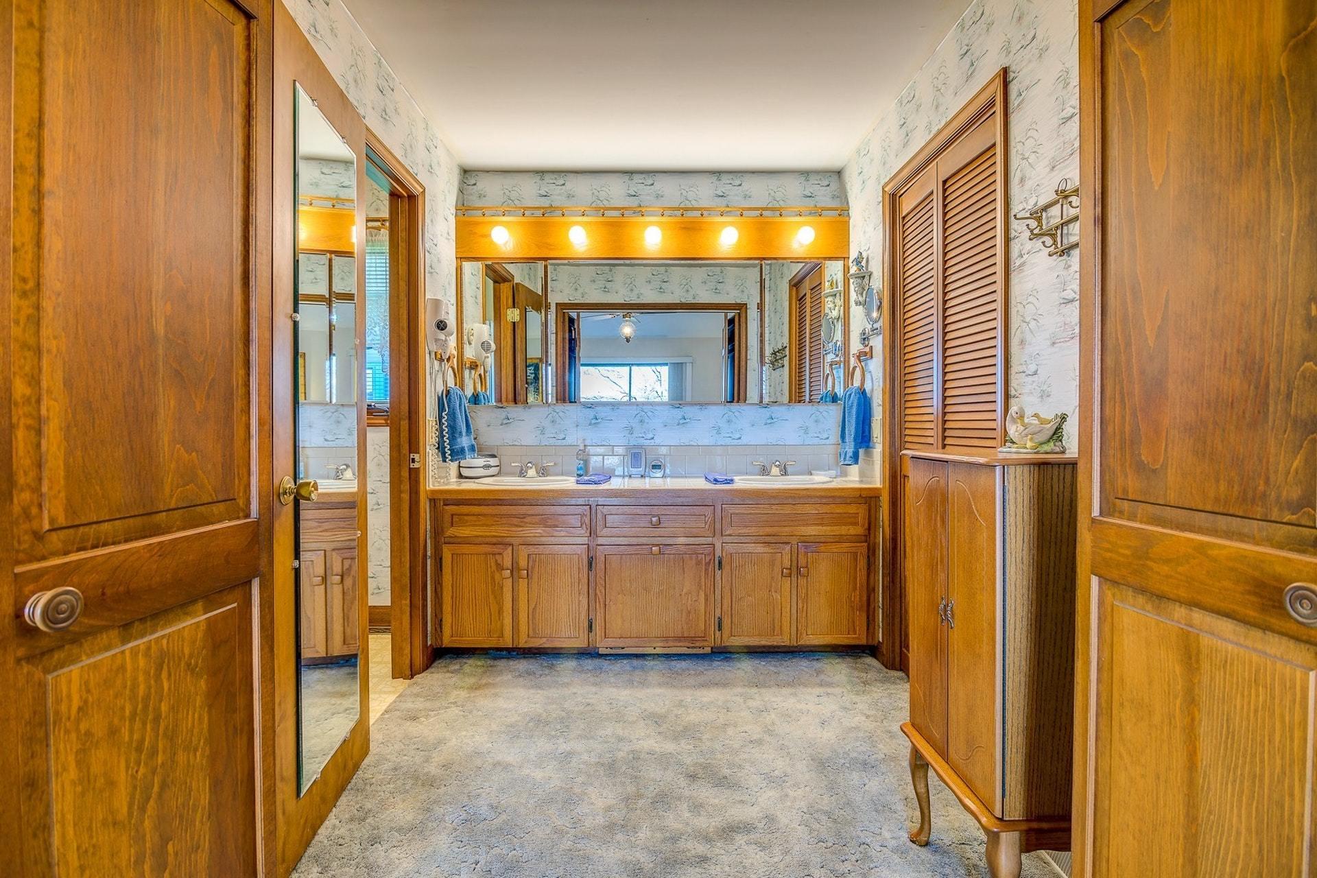 3624 Kemp Ford Road Union Hall, VA 24176 - Photo 18 of 60 a bathroom with a granite countertop sink and a mirror