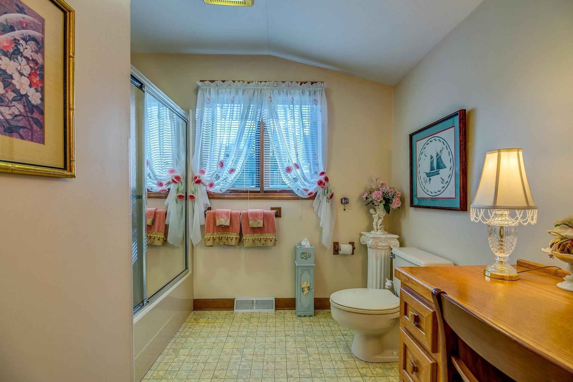 3624 Kemp Ford Road Union Hall, VA 24176 - Photo 24 of 60 a bathroom with a granite countertop toilet sink and mirror