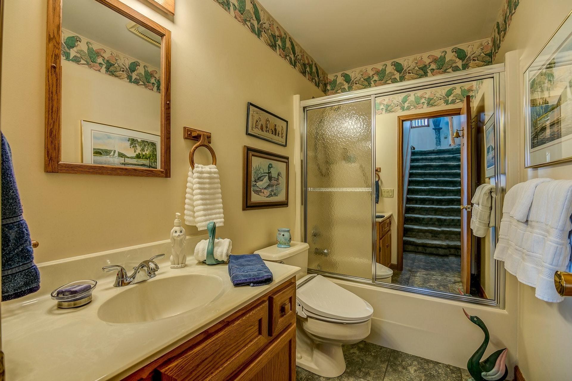 3624 Kemp Ford Road Union Hall, VA 24176 - Photo 26 of 60 a bathroom with a granite countertop toilet sink and mirror