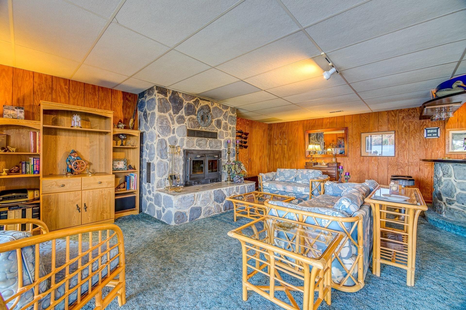 3624 Kemp Ford Road Union Hall, VA 24176 - Photo 29 of 60 a living room with furniture a flat screen tv and a fireplace