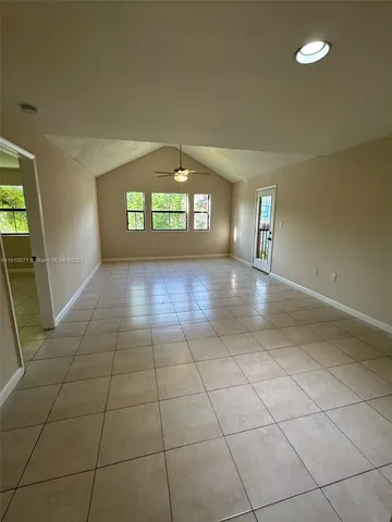a view of a hallway with a window