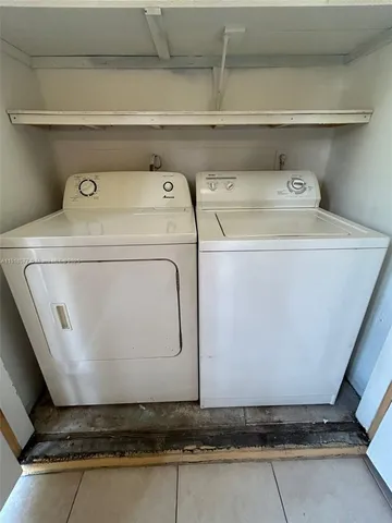 a utility room with washer and dryer
