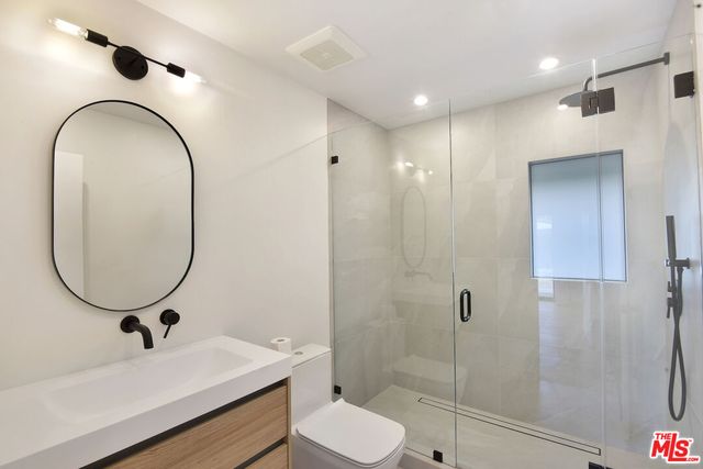 a view of an empty room with glass door