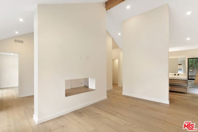 a bathroom with a bathtub and a sink