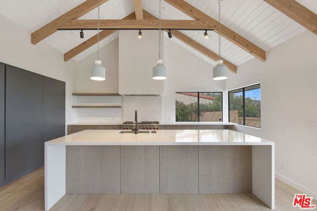 a view of a livingroom with furniture wooden floor and window