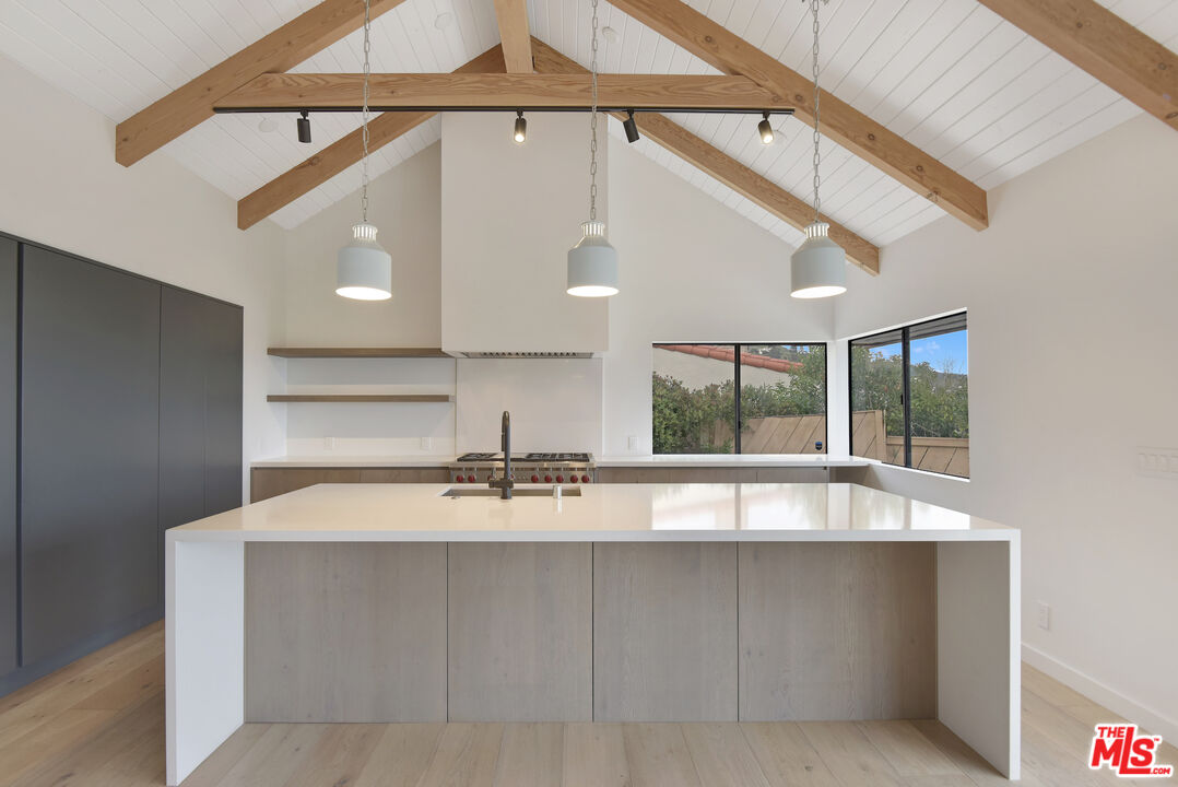 24728 Vantage Point Terrace Malibu, CA 90265 - Photo 6 of 36 a view of a kitchen with a sink and a window