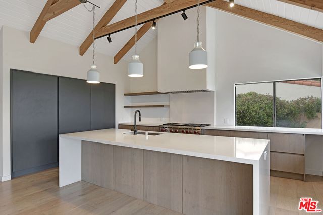 a kitchen with a sink and a stove