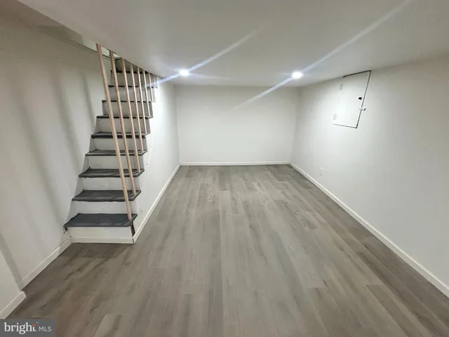 a view of entryway with stairs and wooden floor