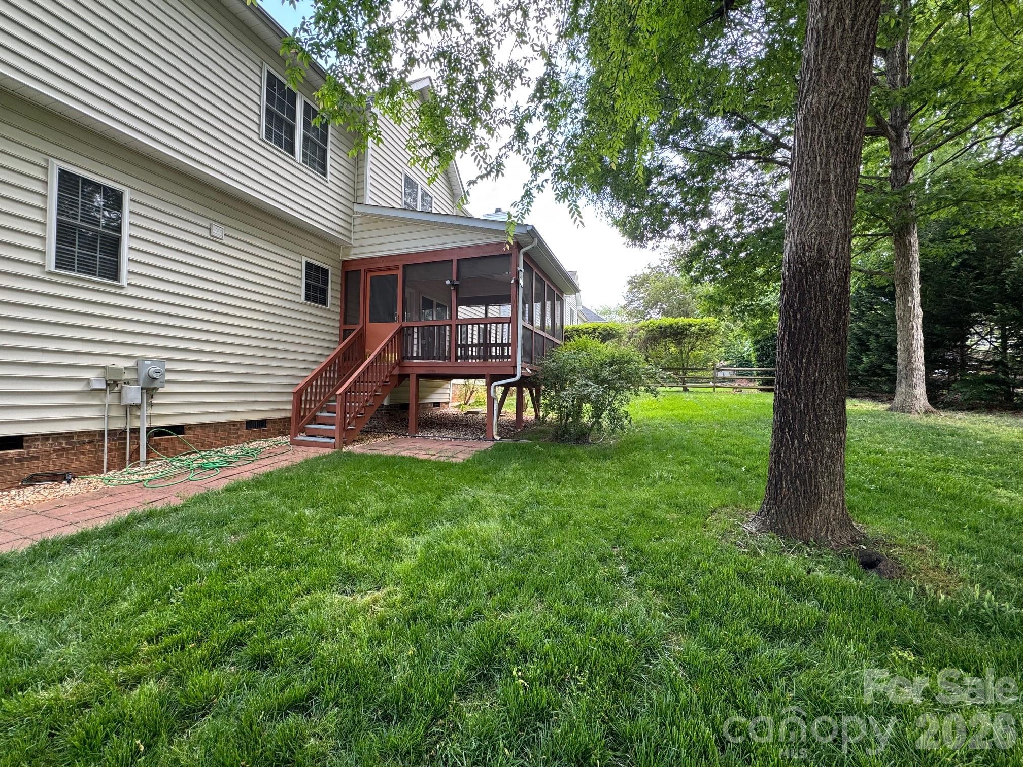 16905 Laureate Road, Unit 16 Huntersville, NC 28078 - Photo 5 of 38 a view of a house with a yard