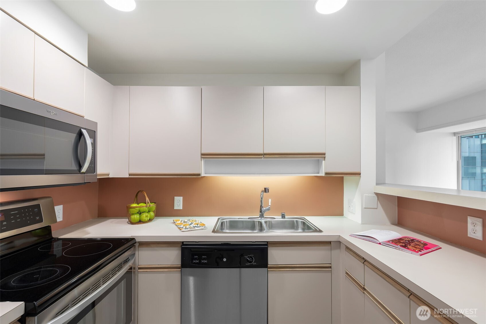 98 Union Street, Unit 408 Seattle, WA 98101 - Photo 11 of 30 a kitchen with a sink and cabinets