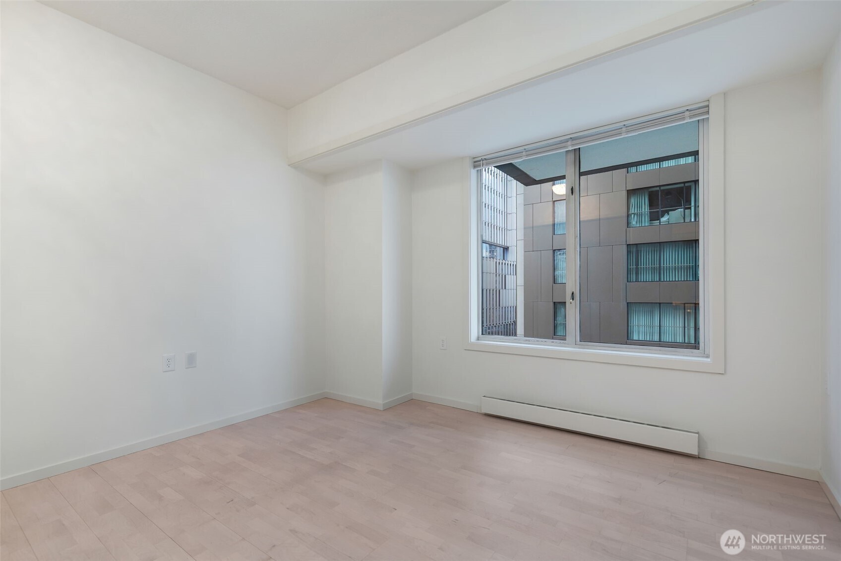 98 Union Street, Unit 408 Seattle, WA 98101 - Photo 14 of 30 a view of an empty room with a window