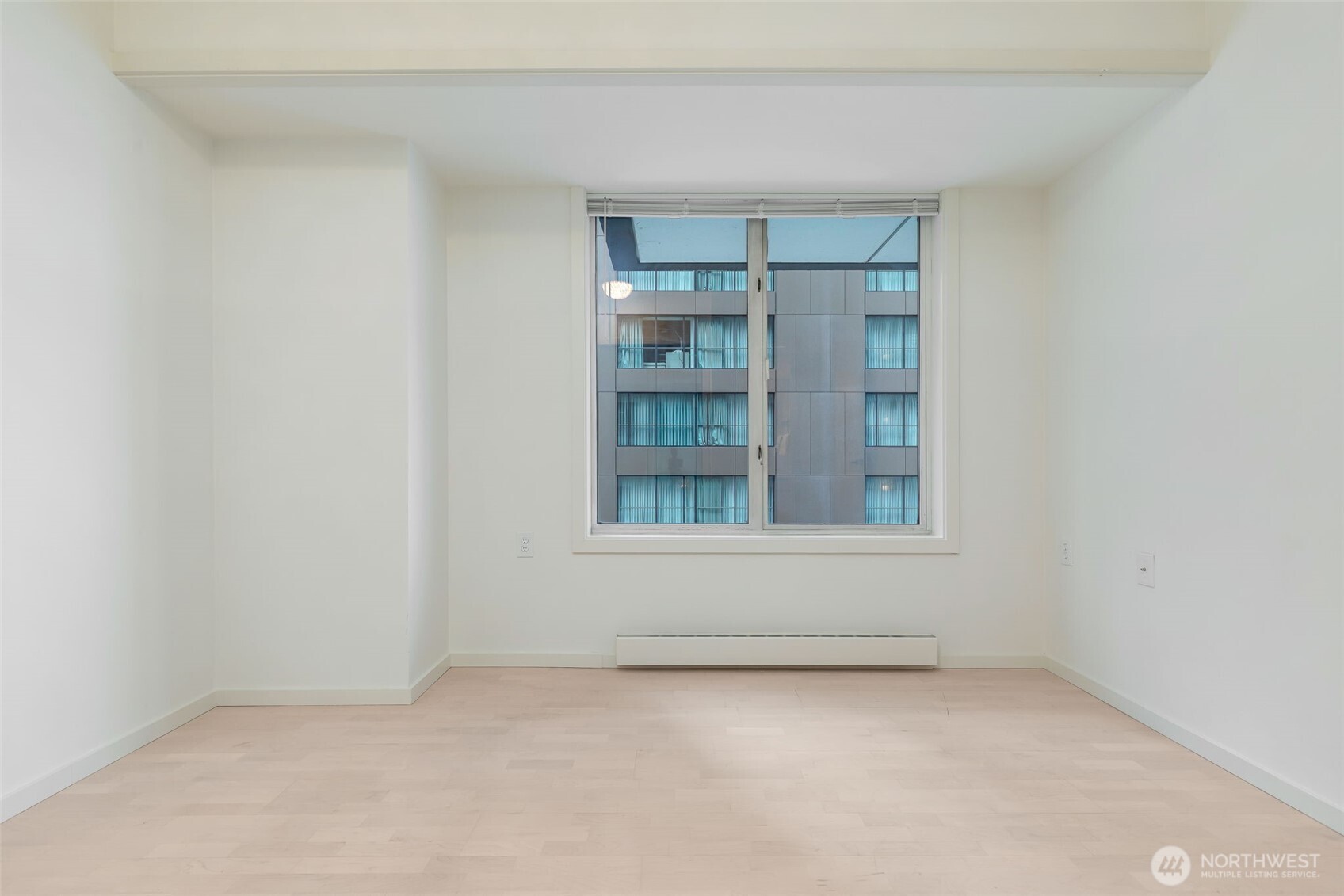 98 Union Street, Unit 408 Seattle, WA 98101 - Photo 15 of 30 a view of an empty room with a window
