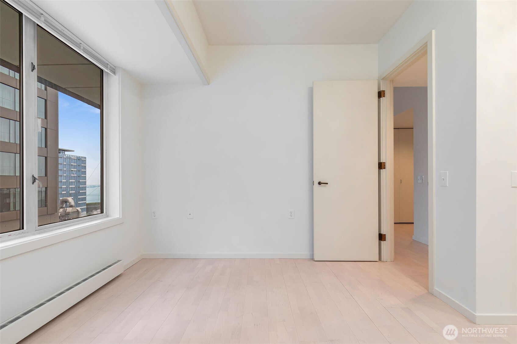 98 Union Street, Unit 408 Seattle, WA 98101 - Photo 17 of 30 a view of an empty room with a window