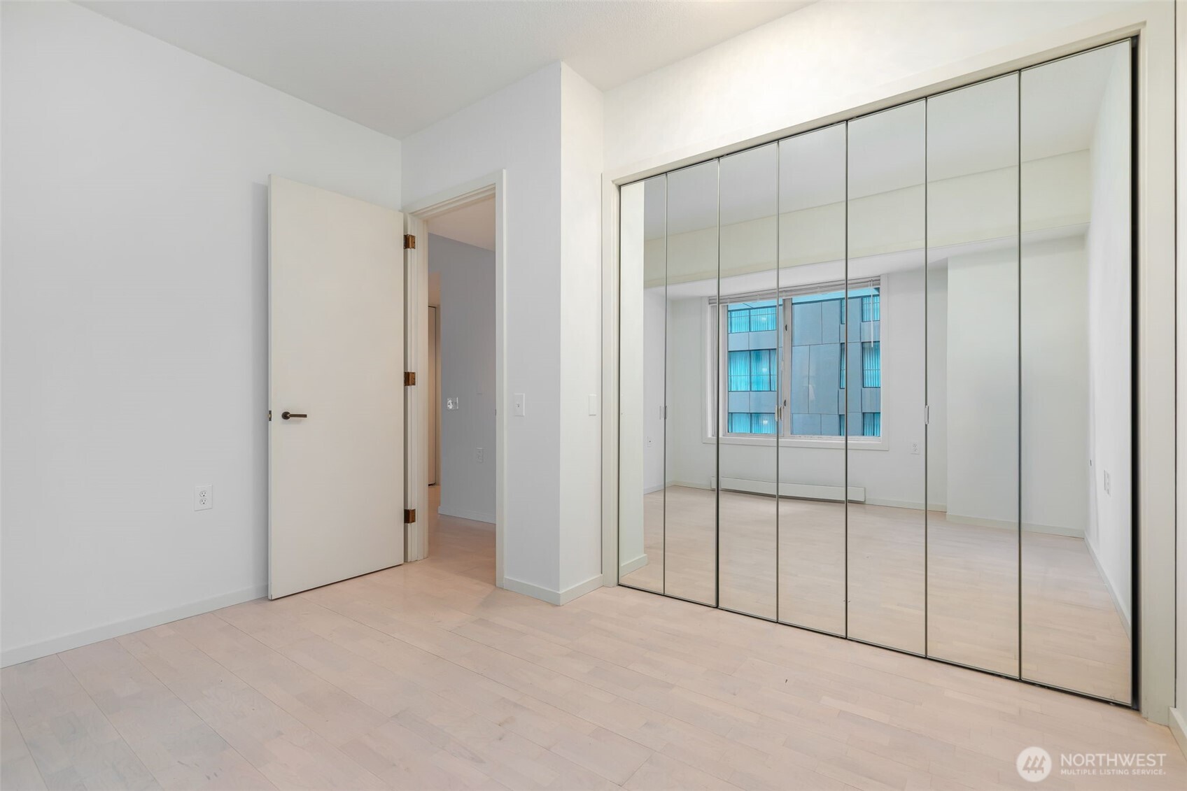 98 Union Street, Unit 408 Seattle, WA 98101 - Photo 18 of 30 an empty room with sliding glass door