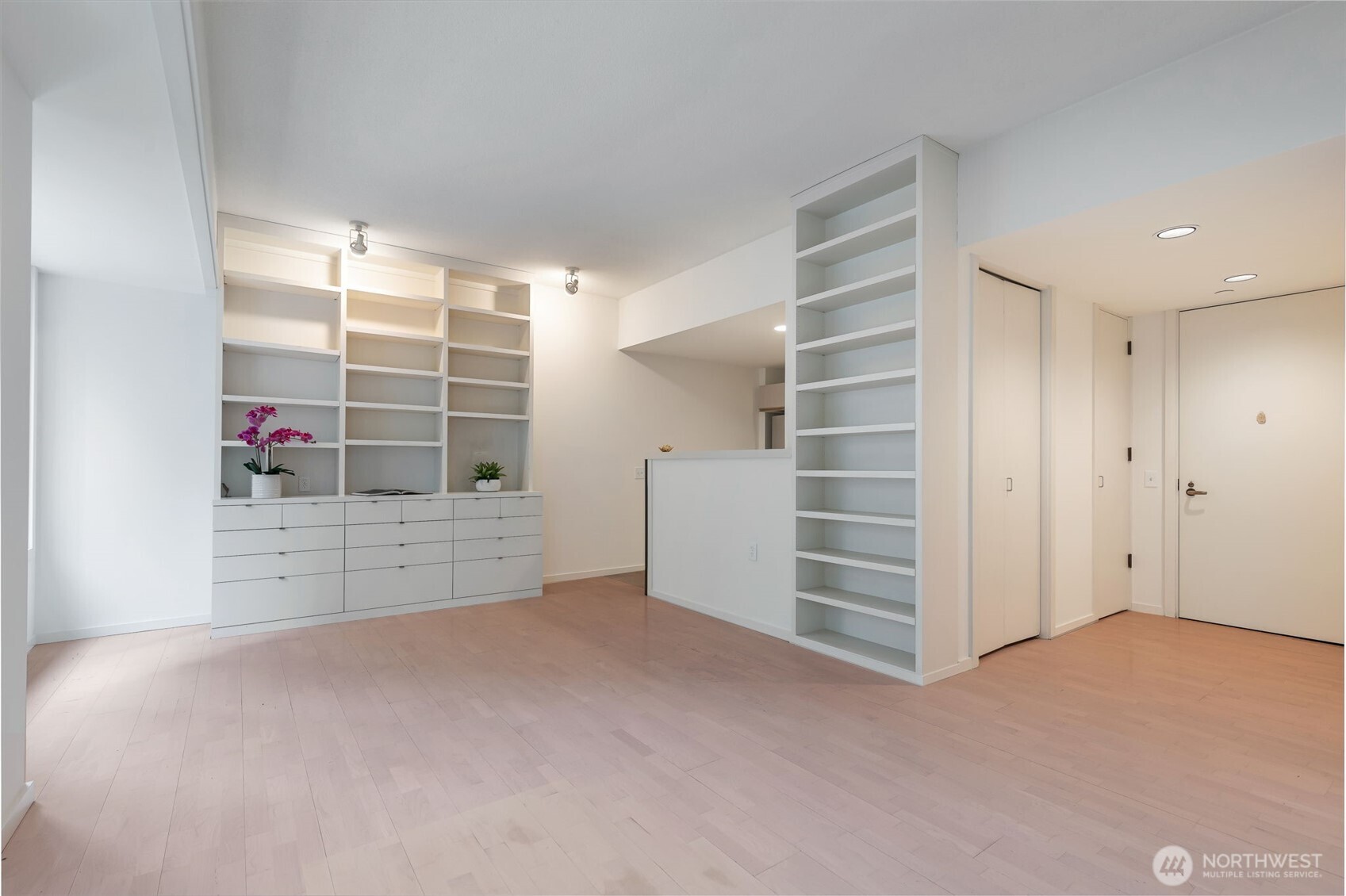 98 Union Street, Unit 408 Seattle, WA 98101 - Photo 6 of 30 a view of an empty room with cabinet and a window