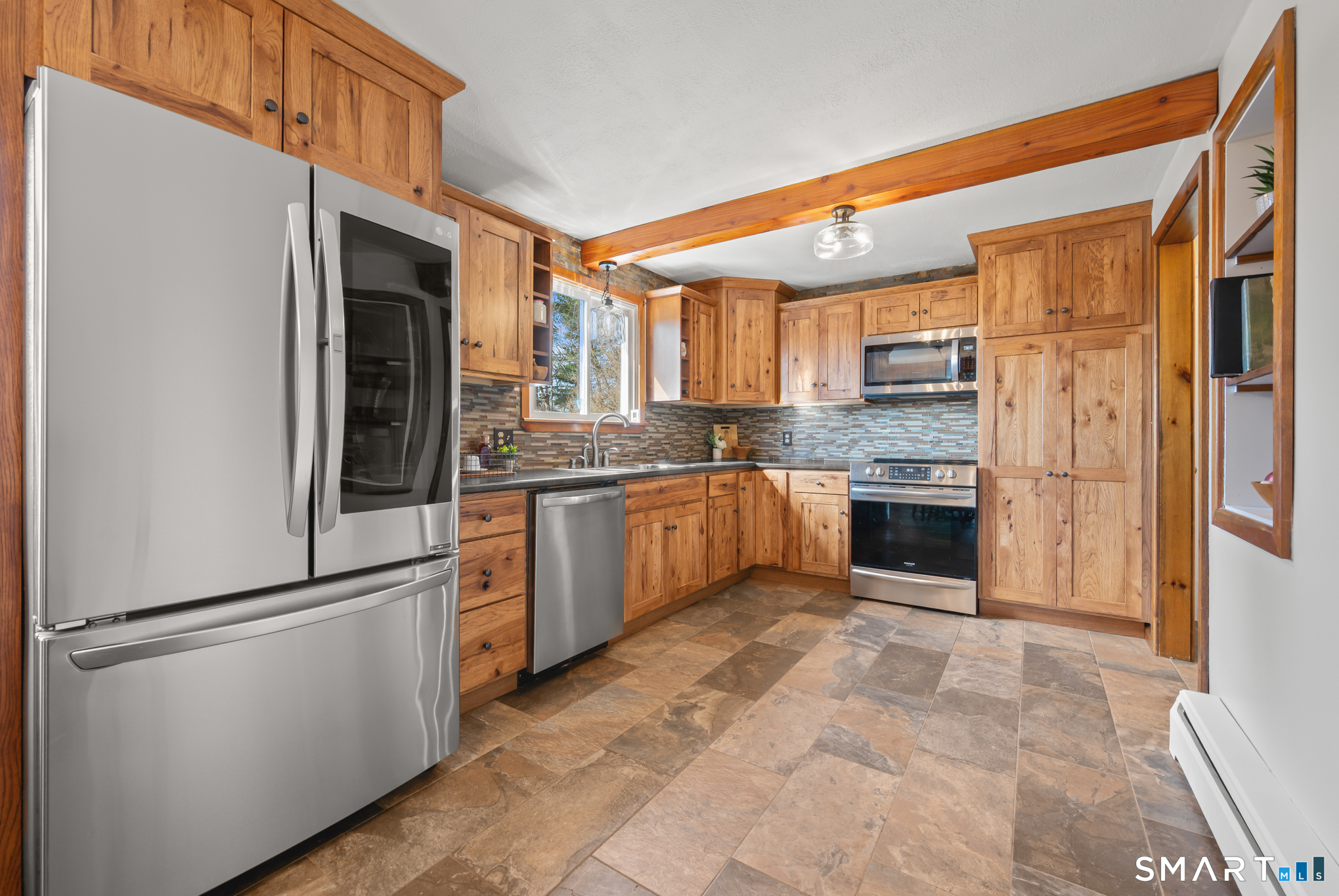 64 Westford Road Eastford, CT 06242 - Photo 13 of 40 a kitchen with stainless steel appliances granite countertop a refrigerator a stove and a sink