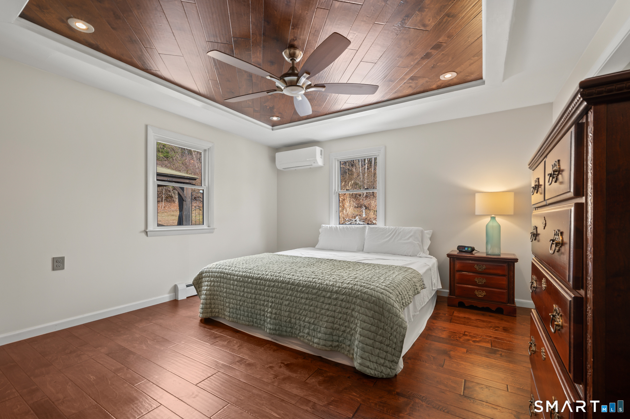 64 Westford Road Eastford, CT 06242 - Photo 19 of 40 a bedroom with a bed and a chandelier