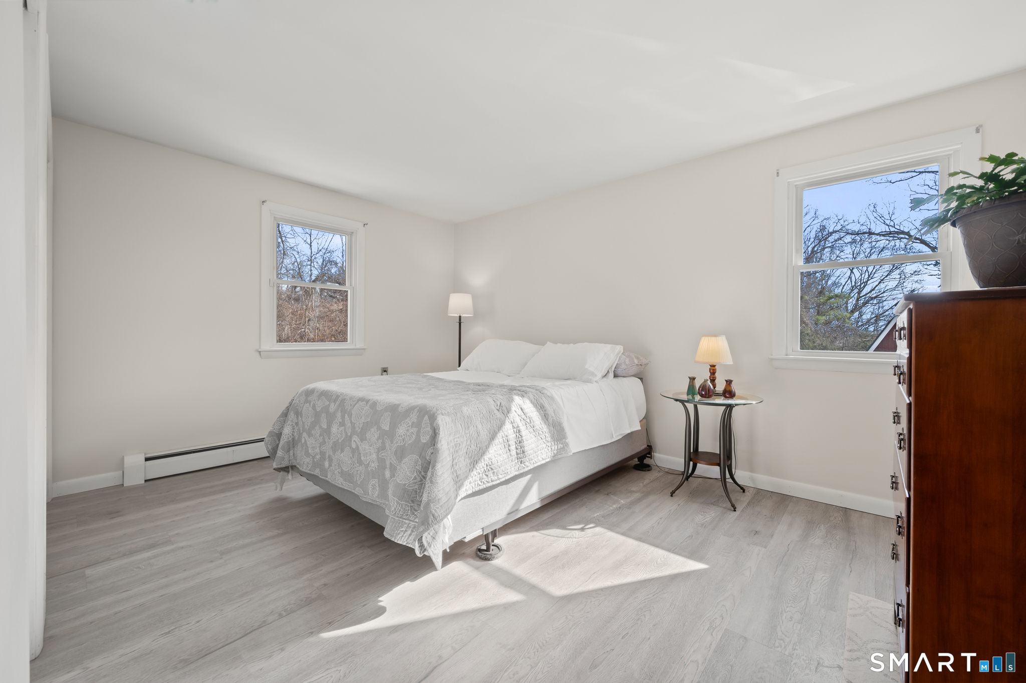 64 Westford Road Eastford, CT 06242 - Photo 23 of 40 a bedroom with a bed and a painting on the wall