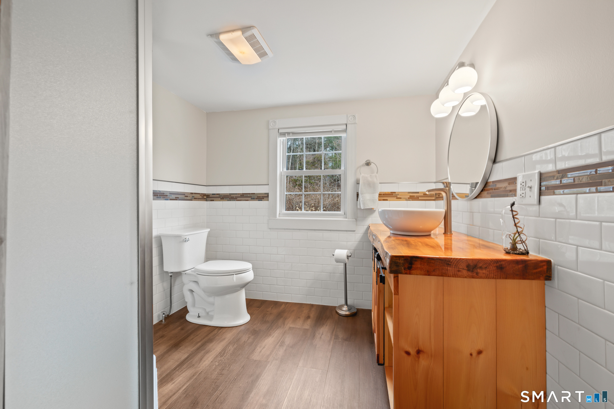 64 Westford Road Eastford, CT 06242 - Photo 28 of 40 a room with a toilet and a window