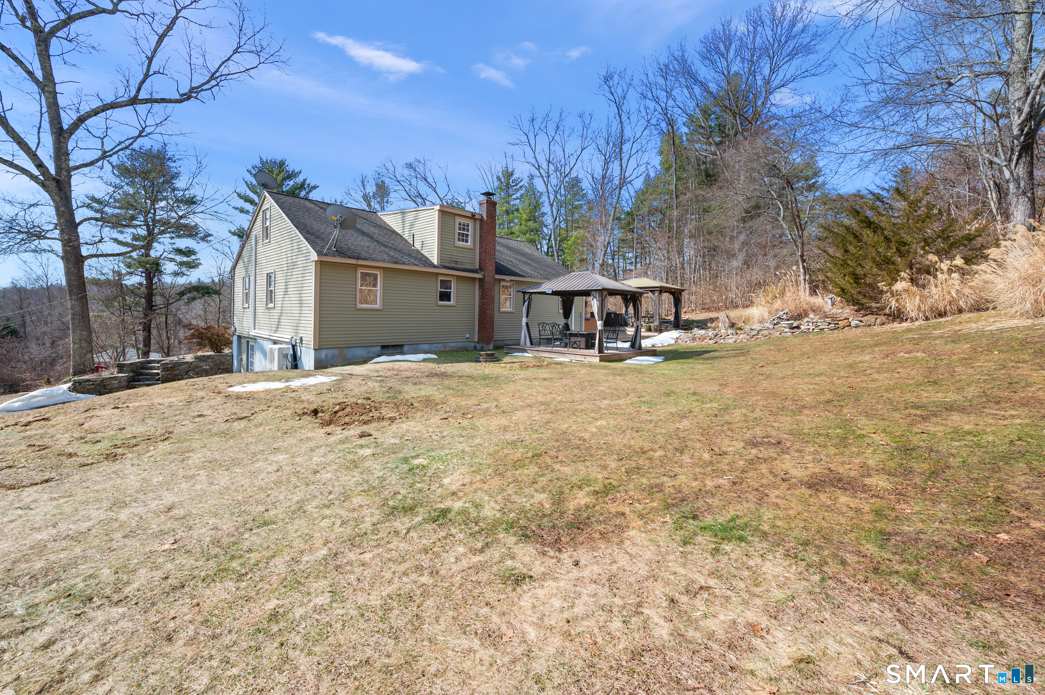 64 Westford Road Eastford, CT 06242 - Photo 3 of 40 a view of a house with a yard and covered with snow