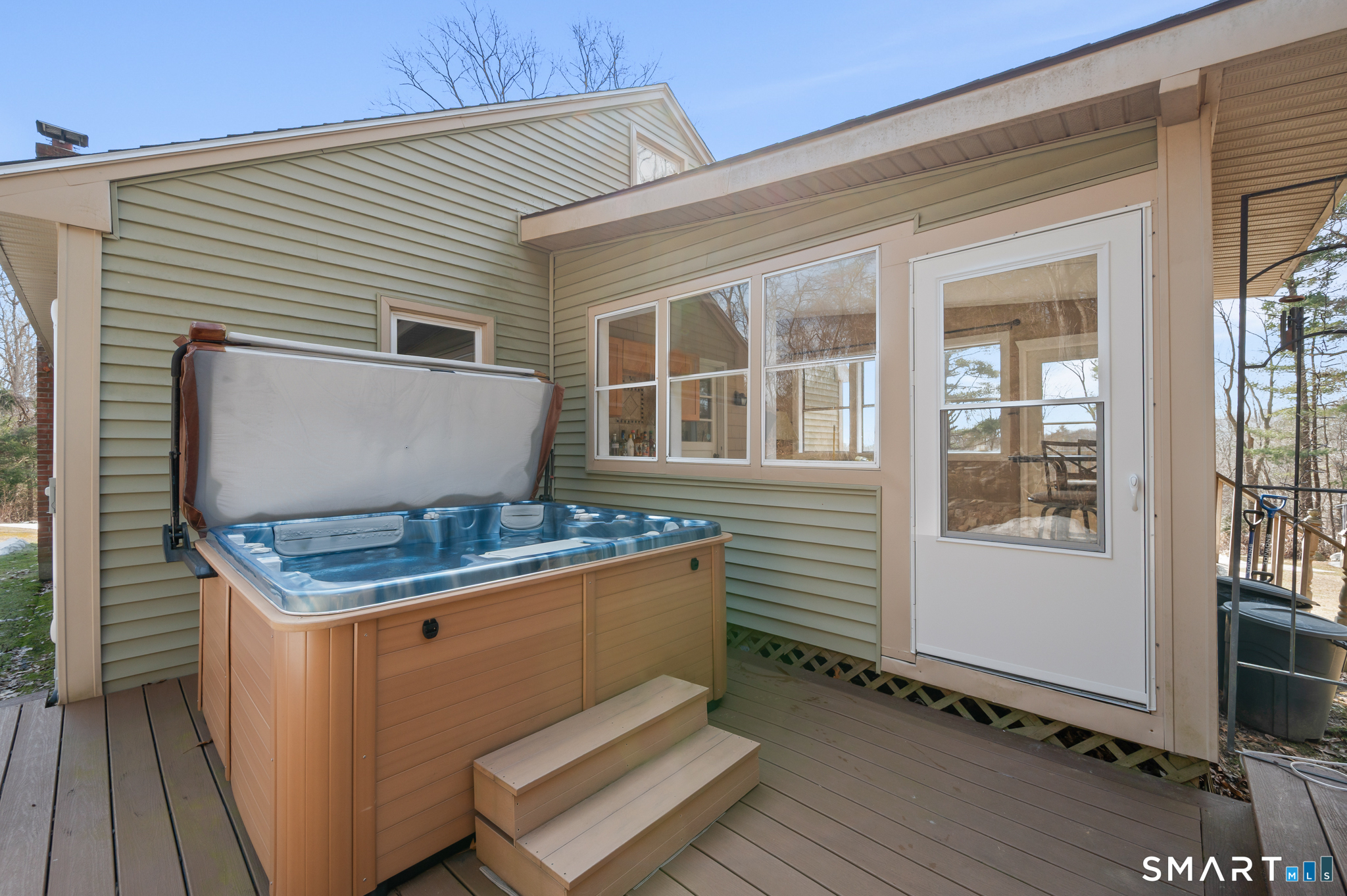64 Westford Road Eastford, CT 06242 - Photo 7 of 40 a view of a house with a barbeque grill and wooden floor