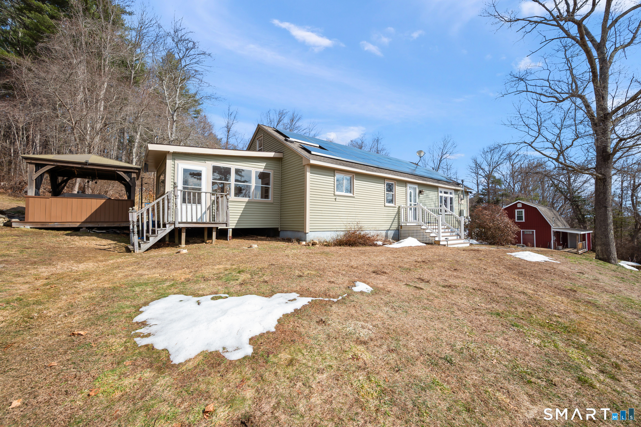64 Westford Road Eastford, CT 06242 - Photo 10 of 40 a view of a house with a yard covered in snow