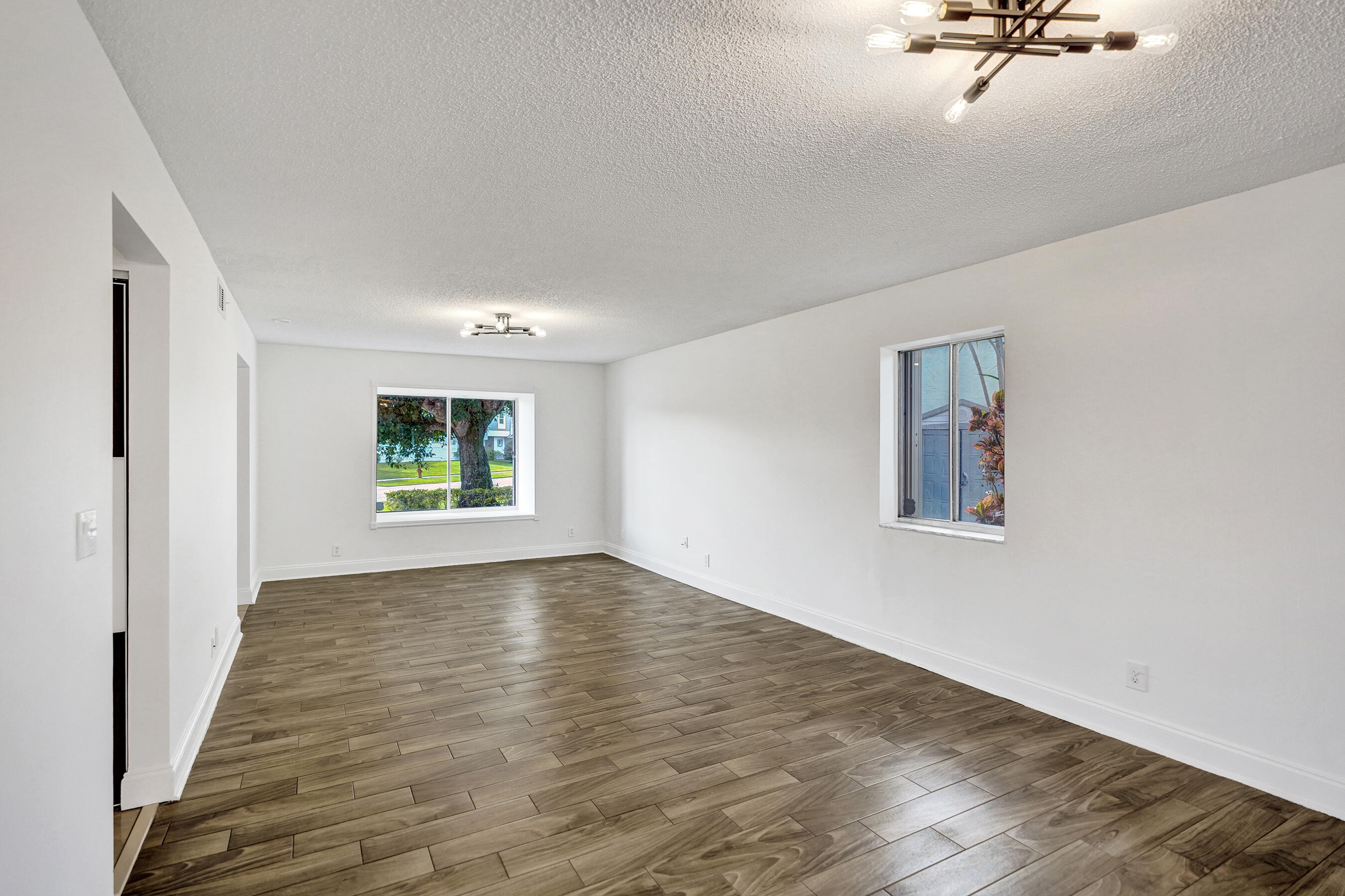 9855 Robins Nest Road Boca Raton, FL 33496 - Photo 17 of 84 a view of a room with a window and wooden floor