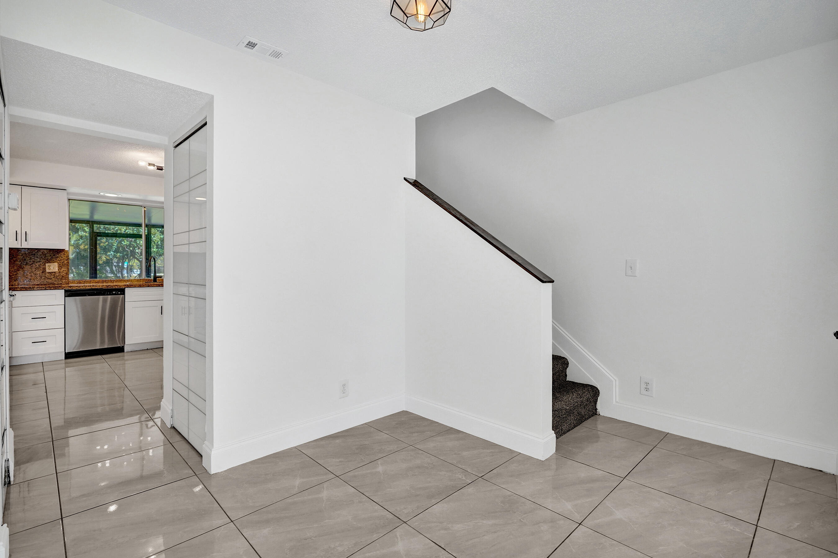9855 Robins Nest Road Boca Raton, FL 33496 - Photo 20 of 84 a view of a hallway to rooms and stairs