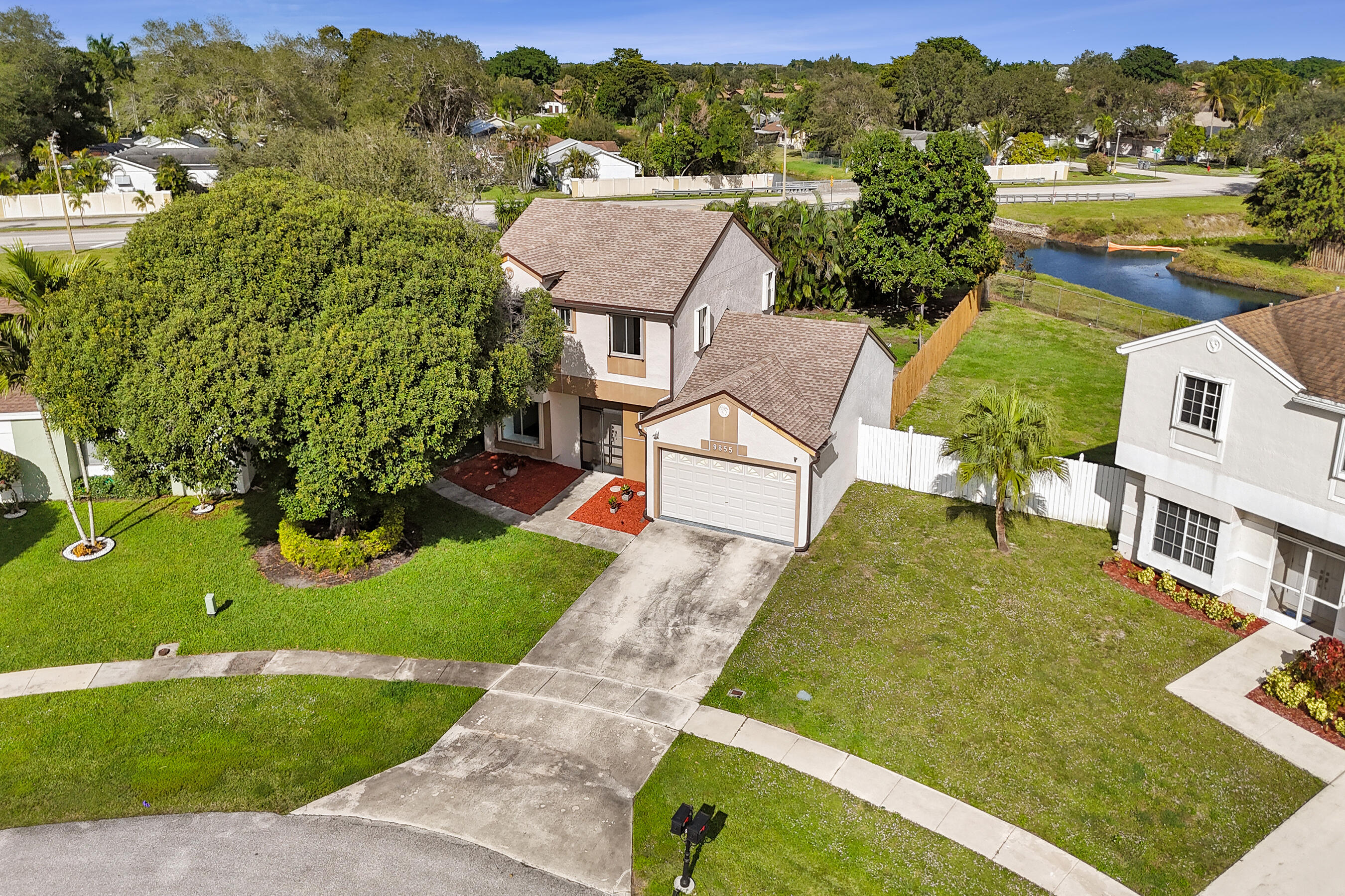 9855 Robins Nest Road Boca Raton, FL 33496 - Photo 2 of 84 an aerial view of residential houses with outdoor space and street view
