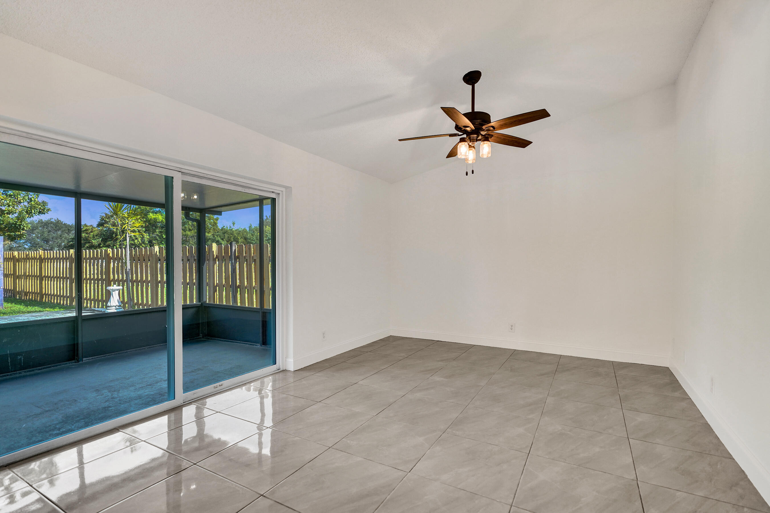 9855 Robins Nest Road Boca Raton, FL 33496 - Photo 26 of 84 wooden floor in an empty room with a window