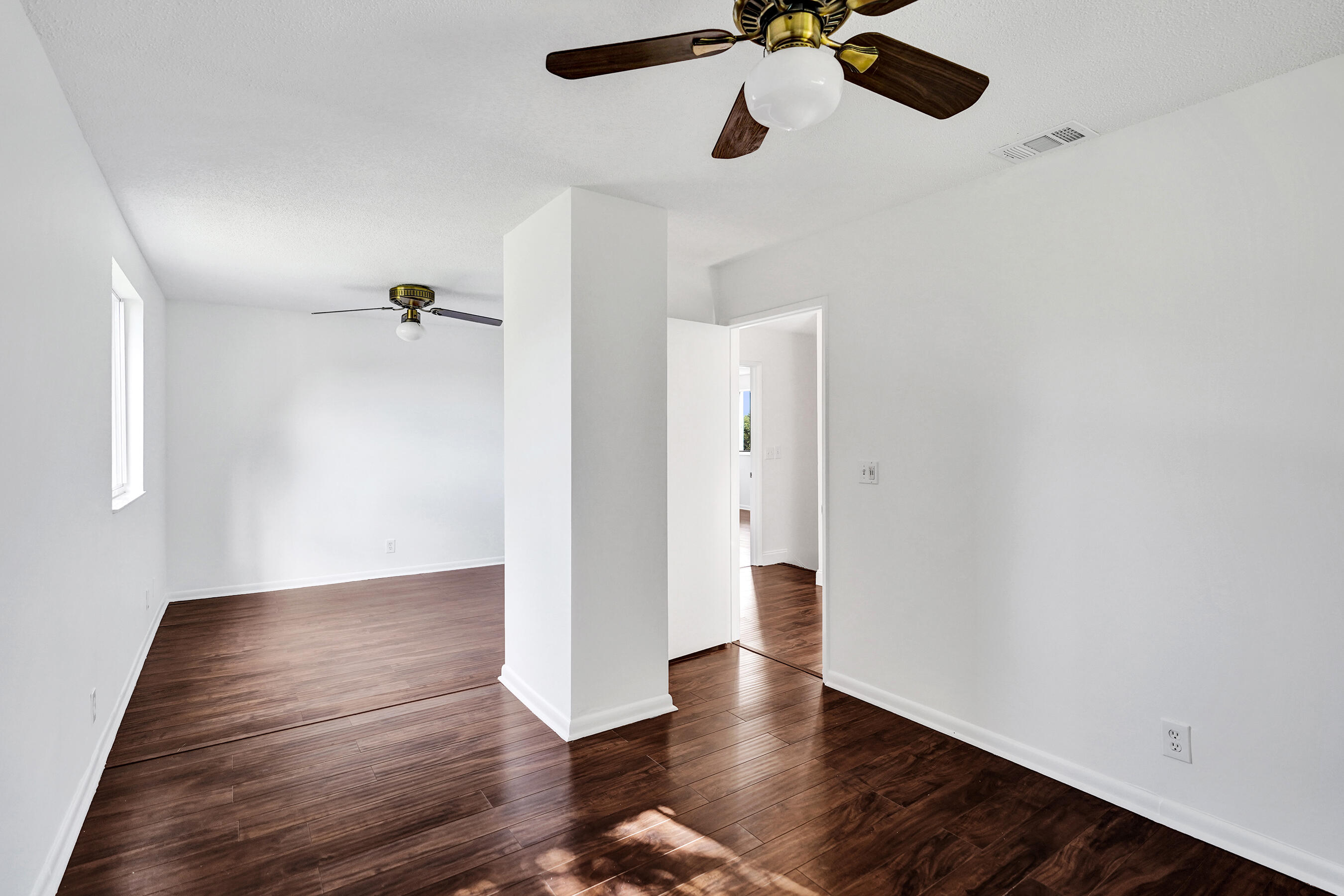 9855 Robins Nest Road Boca Raton, FL 33496 - Photo 30 of 84 wooden floor in an empty room with a window