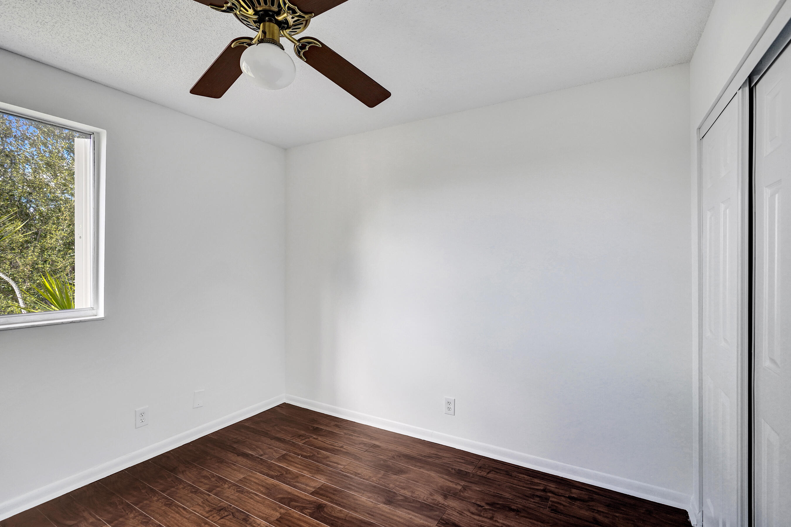 9855 Robins Nest Road Boca Raton, FL 33496 - Photo 33 of 84 a view of an empty room with a window