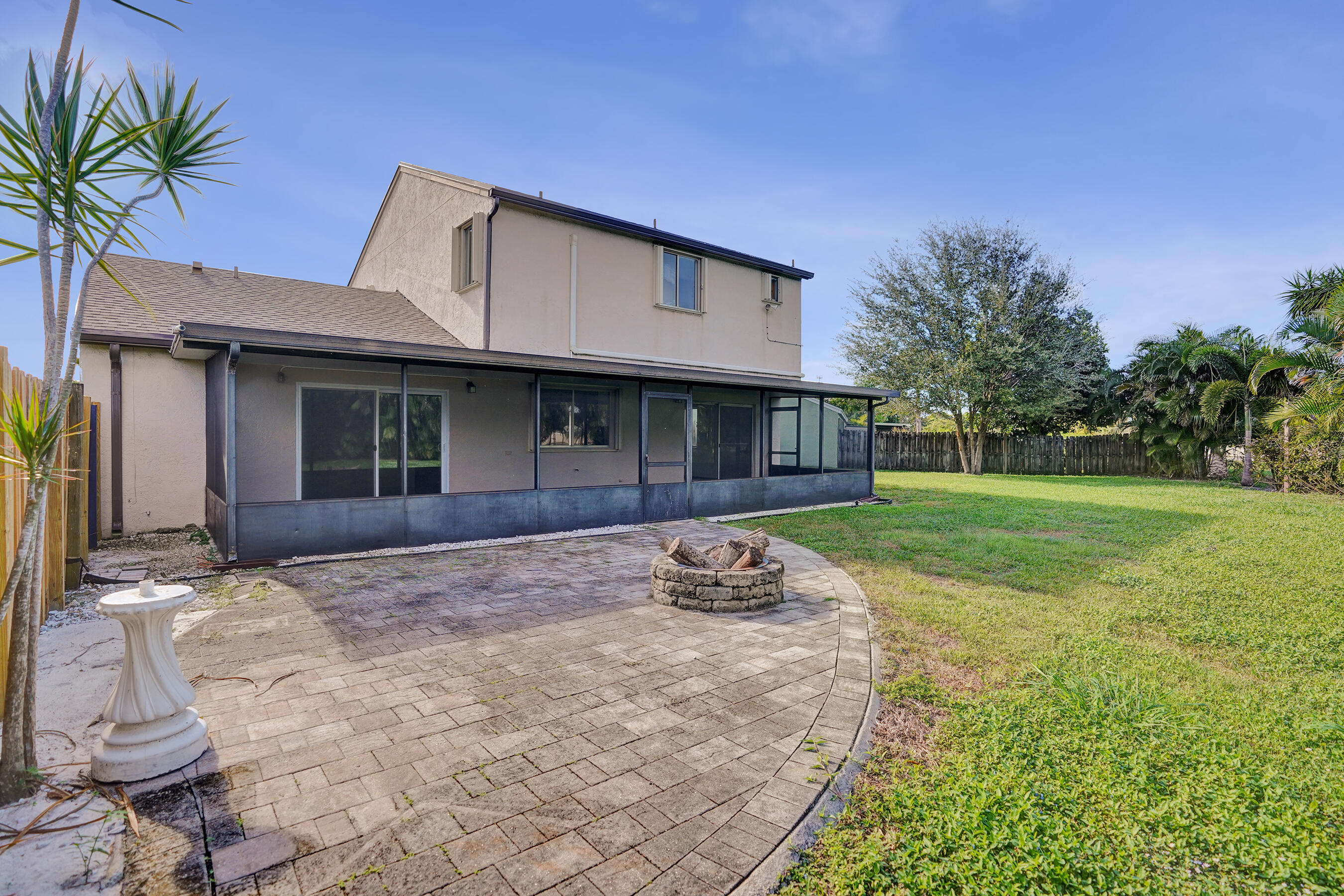 9855 Robins Nest Road Boca Raton, FL 33496 - Photo 62 of 84 a view of a house with a yard