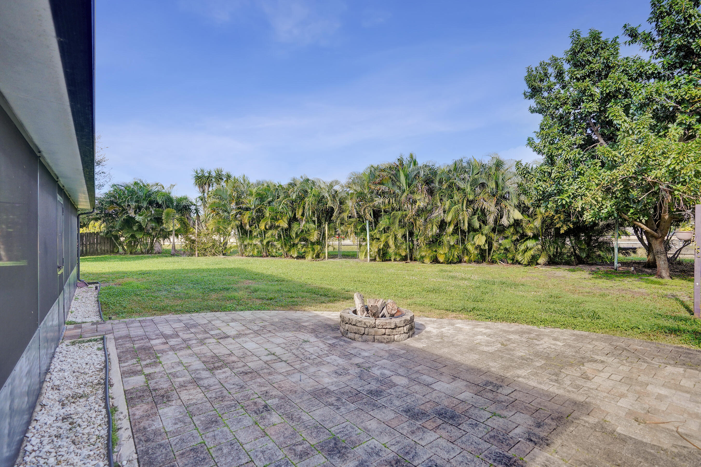 9855 Robins Nest Road Boca Raton, FL 33496 - Photo 63 of 84 a view of field with trees in the background