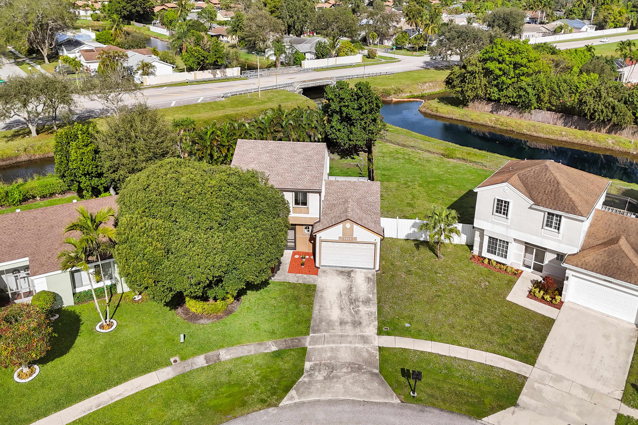 9855 Robins Nest Road Boca Raton, FL 33496 - Photo 74 of 84 an aerial view of a house with garden space and street view