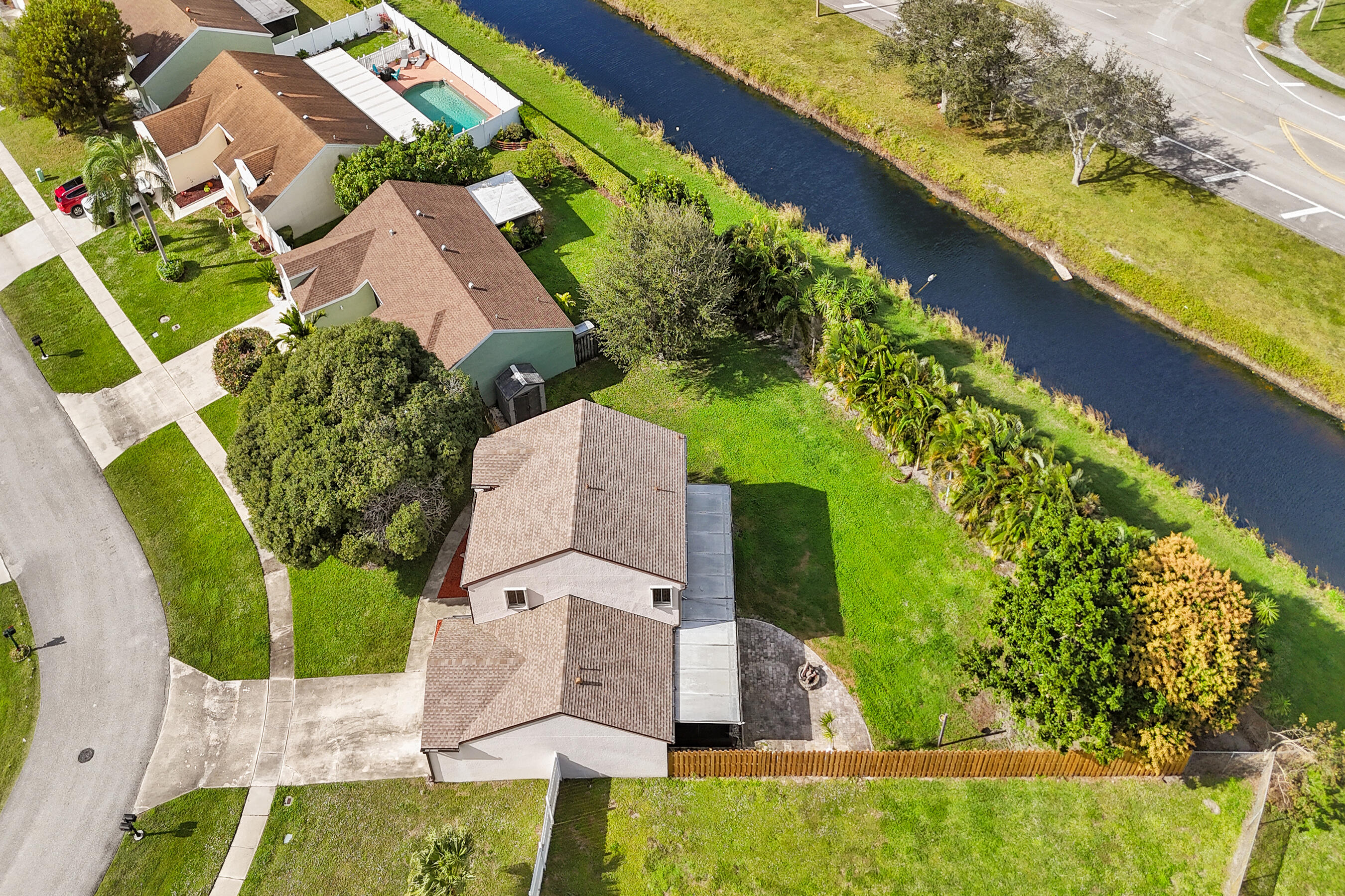 9855 Robins Nest Road Boca Raton, FL 33496 - Photo 75 of 84 an aerial view of a house with a garden and lake view