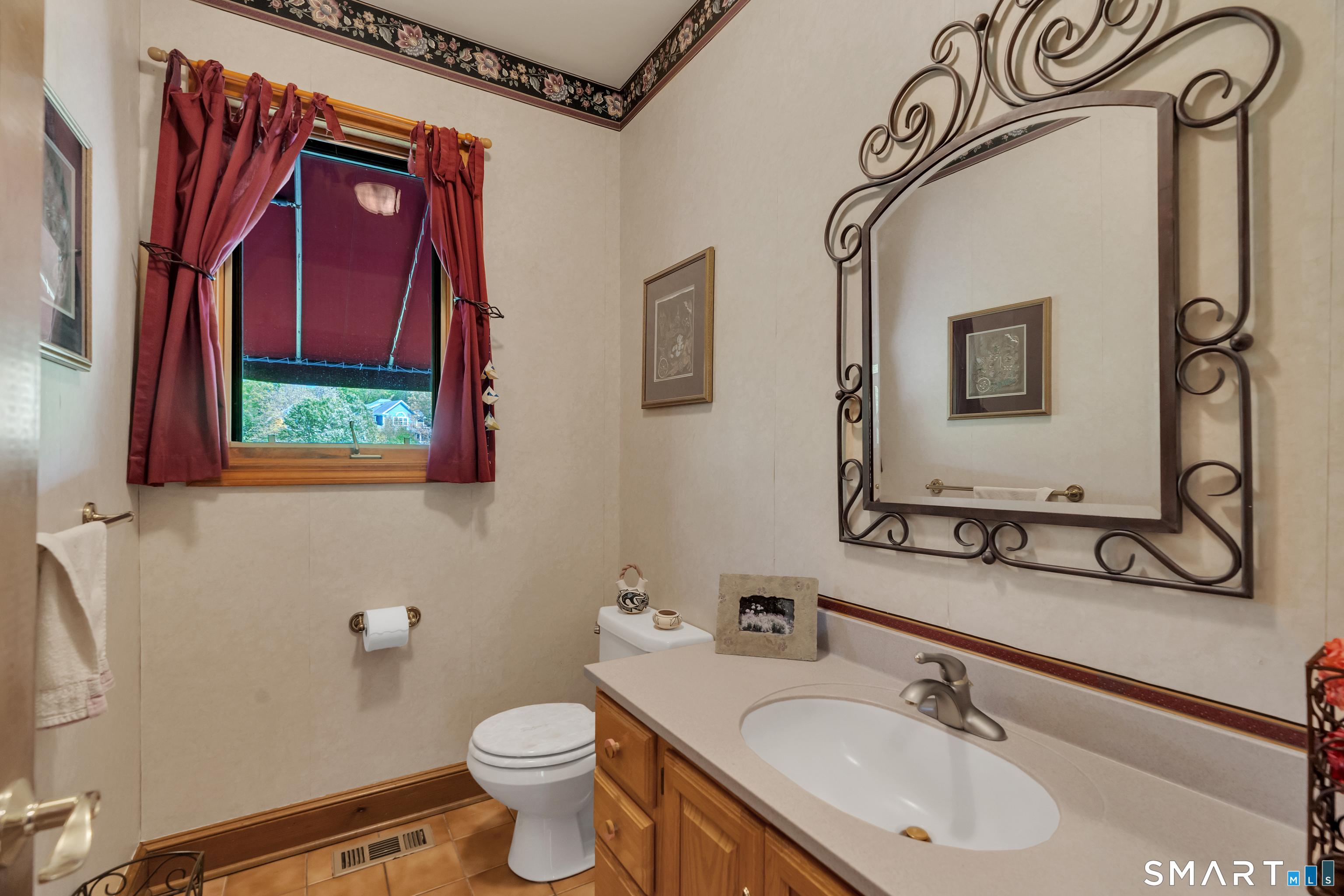 194 Quaker Farms Road Oxford, CT 06478 - Photo 16 of 40 a bathroom with a sink and a mirror