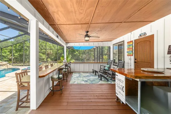 a kitchen with stainless steel appliances kitchen island granite countertop a refrigerator and wooden cabinets