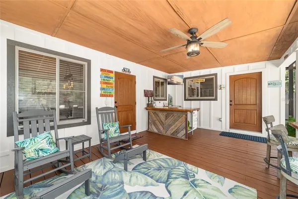 a spacious bedroom with a bed and a flat screen tv