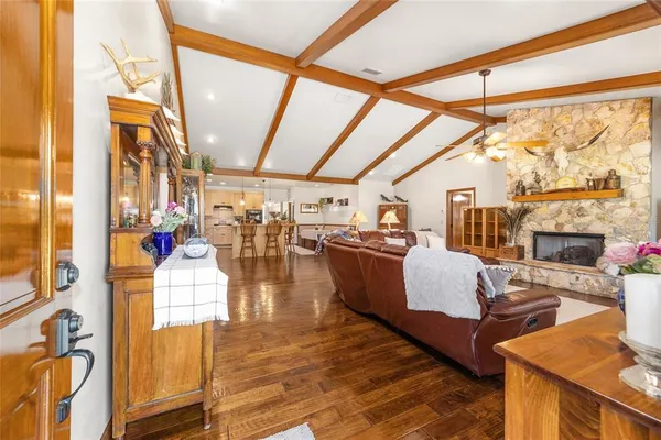 a dining room with furniture and wooden floor